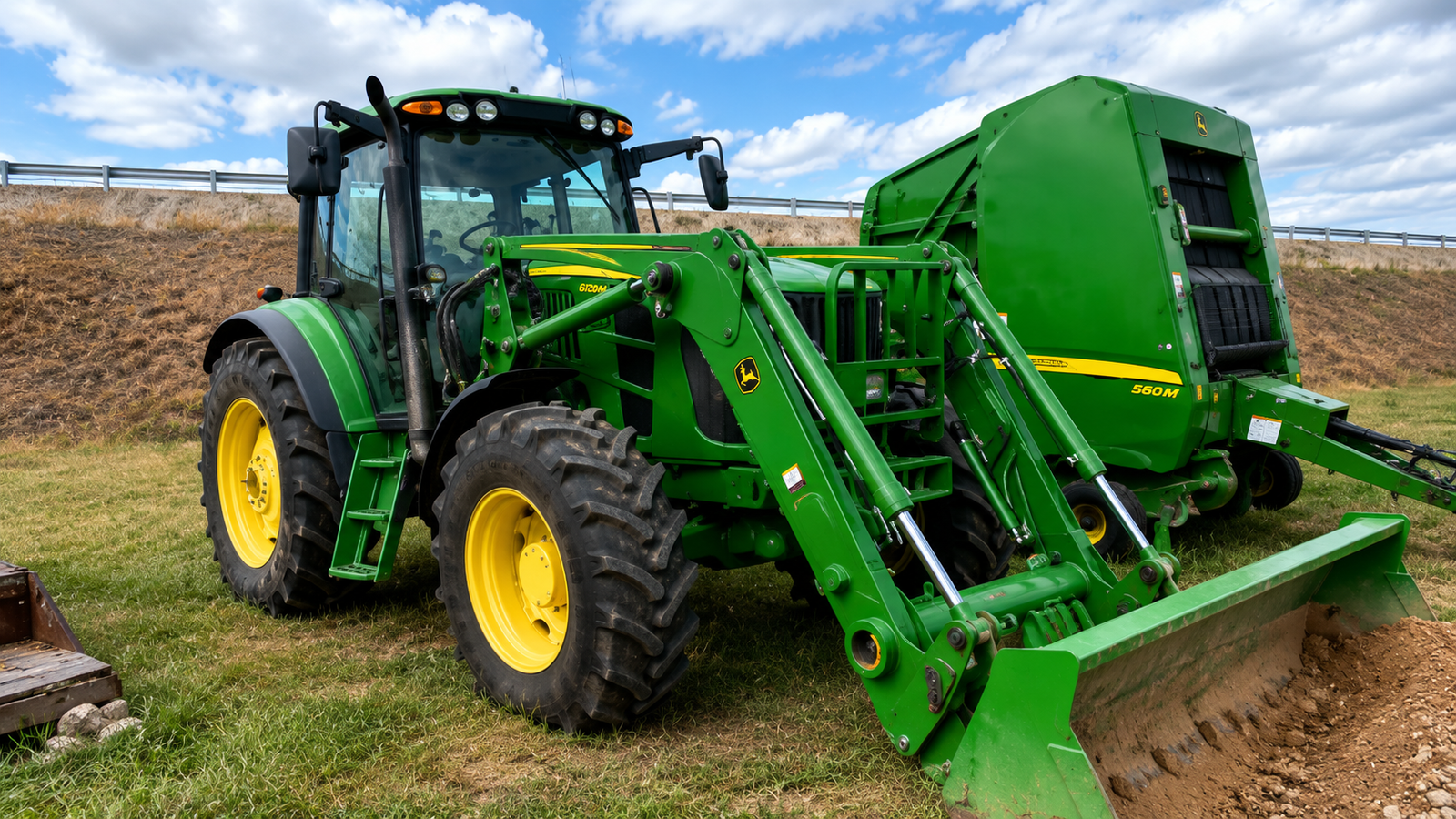 John Deere tractor and baler in field